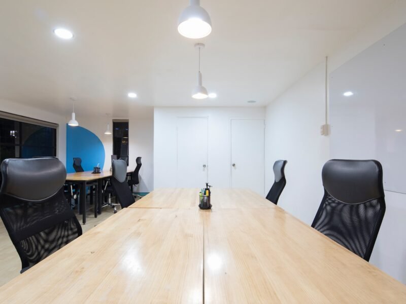 black rolling chairs and brown wooden table